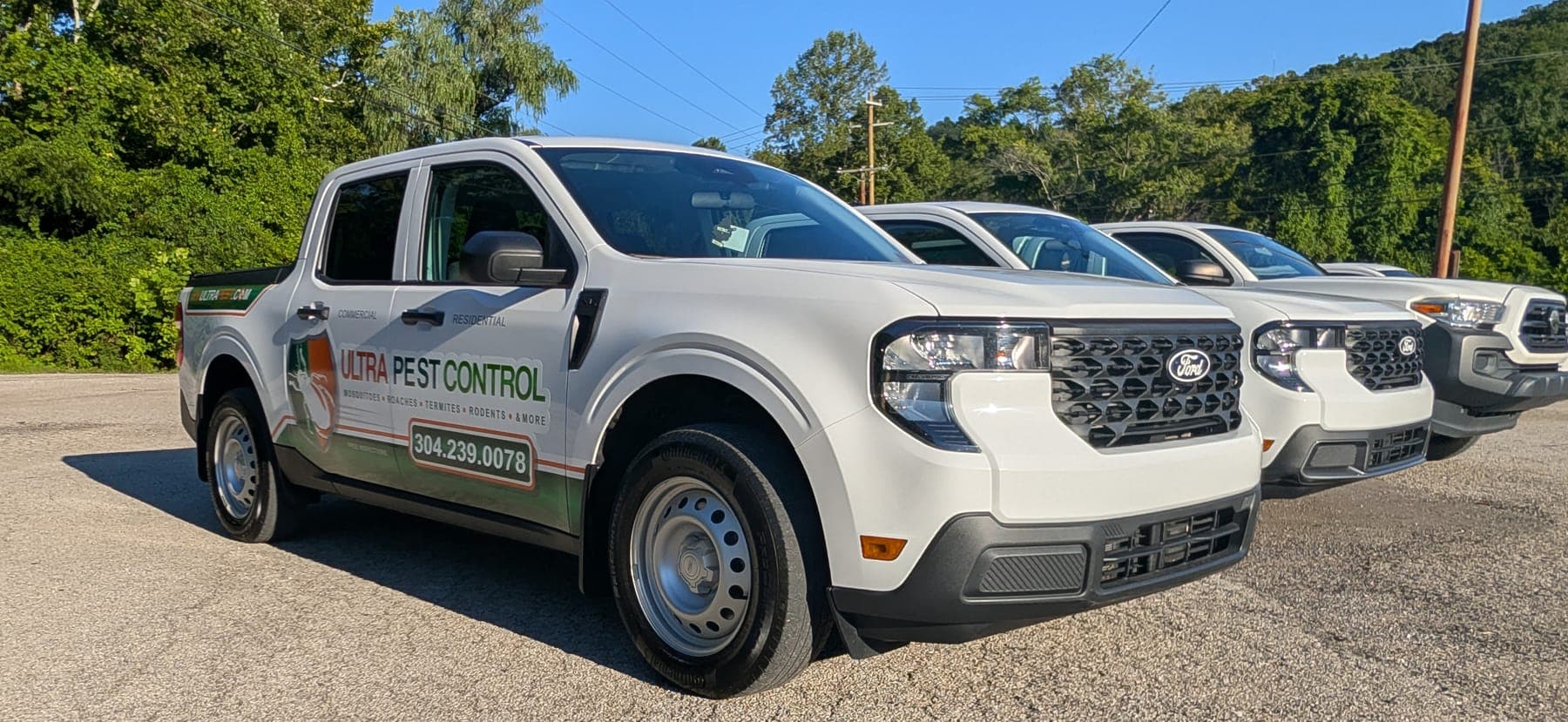 Ultra Pest Control branded service truck marked for commercial and residential service, parked in the Tri-State area